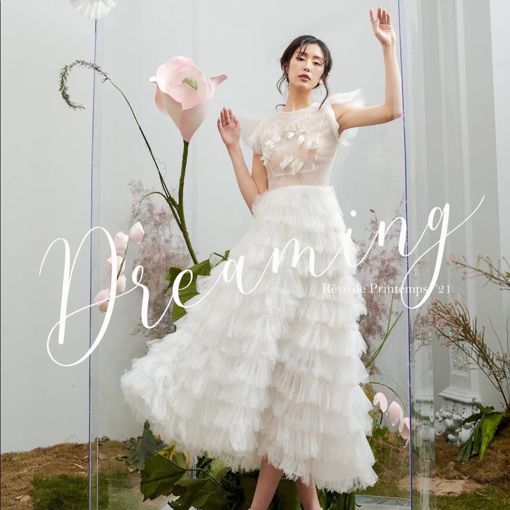 White ankle length dress with ruffles and embroidery